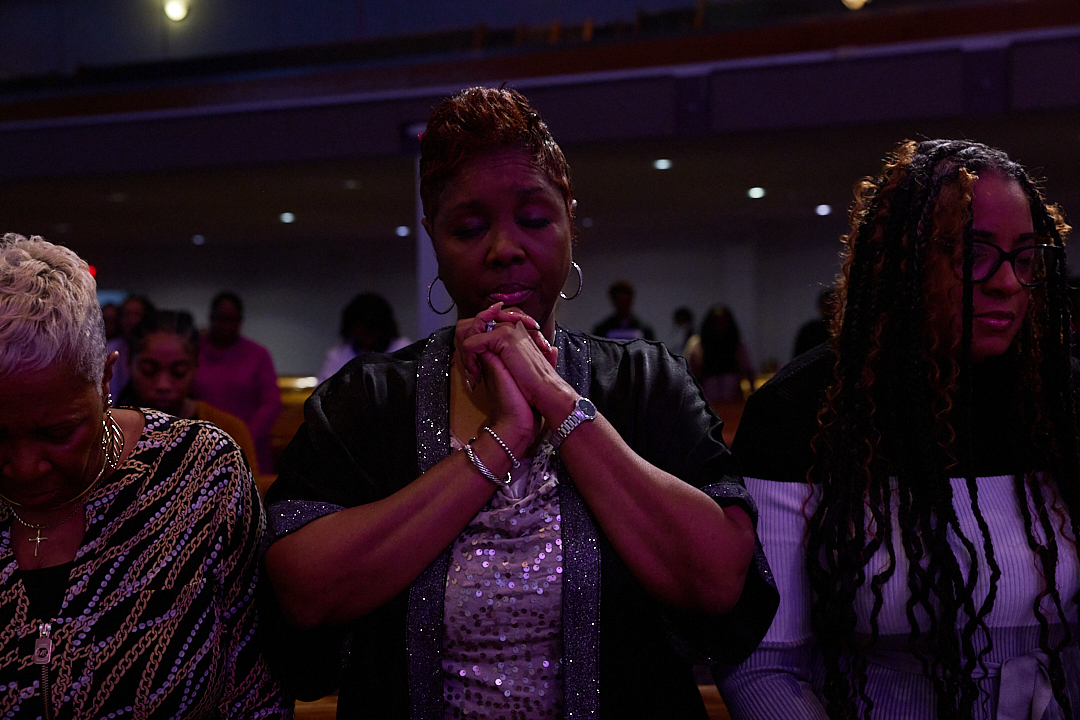 Person praying with hands clasped, seeking how to pray effectively. | go2bethany.com